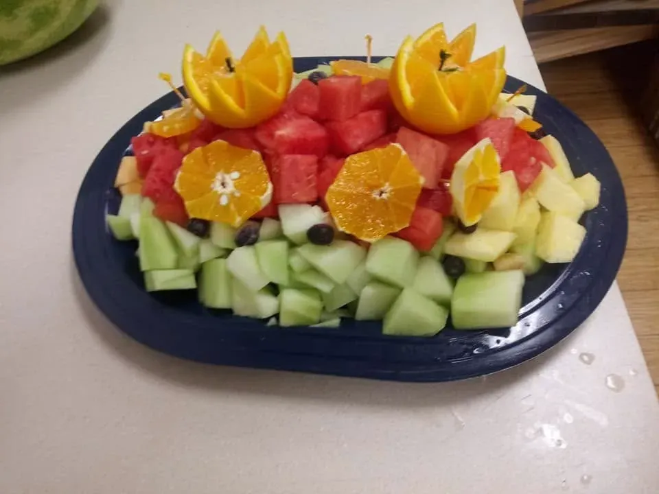 A platter of watermelon, orange, melon and pineapple
