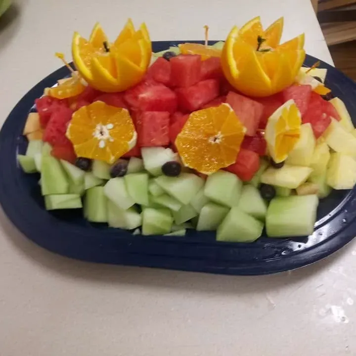 A platter of watermelon, orange, melon and pineapple